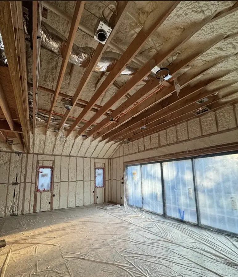 Interior walls and ceiling insulated with spray foam during new construction in Parma